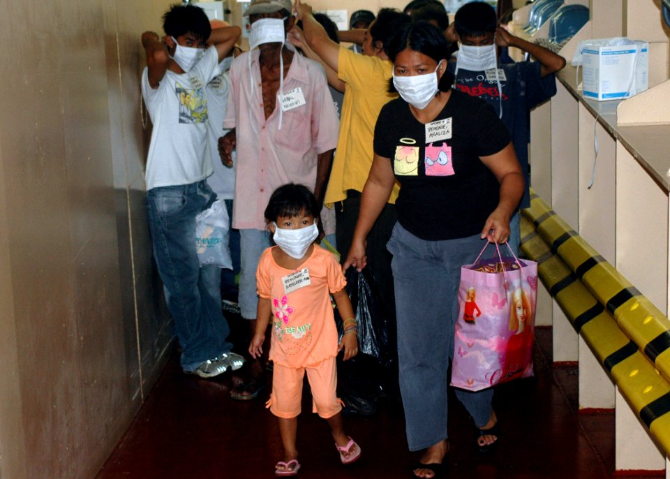 US Navy 060614-N-9076B-162 Patients don mask and began their walk up a ramp to medical treatment facilities the U.S. Military Sealift Command (MSC) Hospital Ship USNS Mercy (T-AH 19)