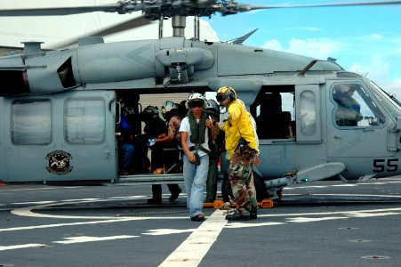 US Navy 060603-N-2832L-091 Patients to receive health care arrive by helicopter to the U.S. Military Sealift Command (MSC) Hospital ship USNS Mercy (T-AH 19)
