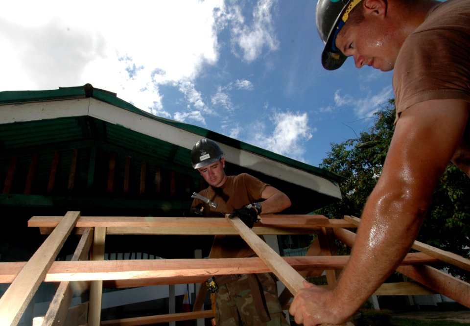 US Navy 060607-N-3532C-026 Navy Seabees assigned to Naval Mobile Construction Battalion Four Zero (NMCB-40) build a table at Sulu Provincial Hospital
