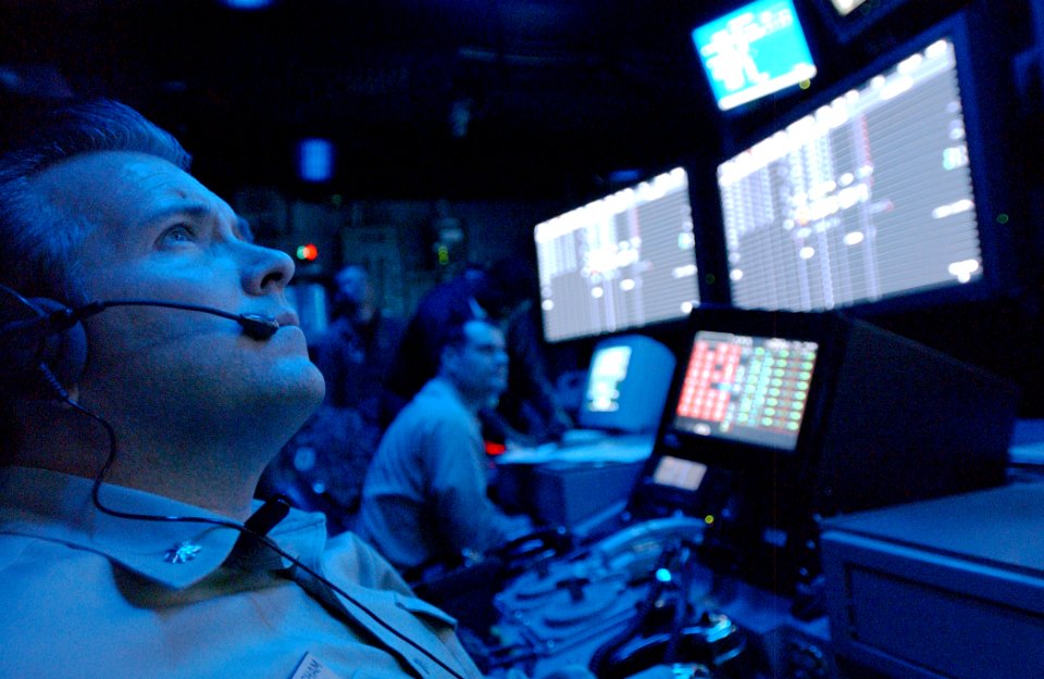 US Navy 060617-N-7526R-264 USS Ronald Reagan (CVN 76) Air Operations Officer, Cmdr. Michael Cunningham, stands watch in the Combat Direction Center