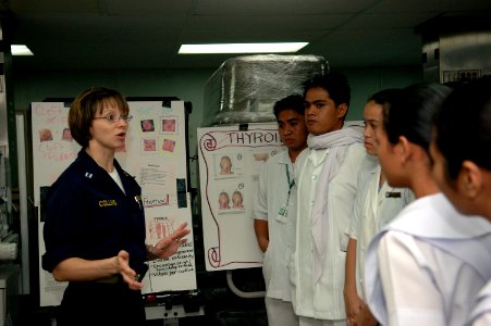 US Navy 060608-N-3714J-085 Navy Lt. Tara Collins, of Le Grange, Ky., gives a group of nursing students from the Jolo Norte Dame Nursing School a tour of the U.S. Military Sealift Command (MSC) Hospital ship USNS Mercy (T-AH 19)