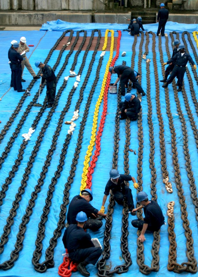 US Navy 060616-N-4953E-004 Boatswain's Mates paint the anchor chains aboard the guided-missile destroyer USS Stethem (DDG 63), while the ship is in the dry dock