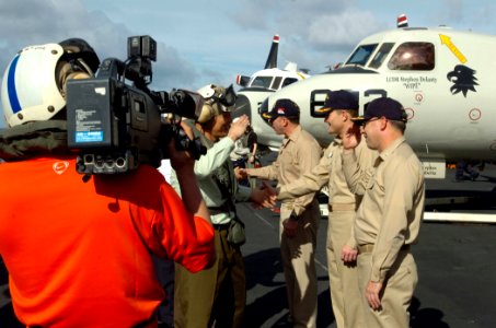 US Navy 060617-N-0555B-133 Capt. Terry Kraft, Carrier Air Wing Fourteen (CVW-14) Commanding Officer, Capt. Craig Williams and Commodore of Destroyer Squadron Seven (DESRON-7), Capt. David Steindl welcome civilian and military d