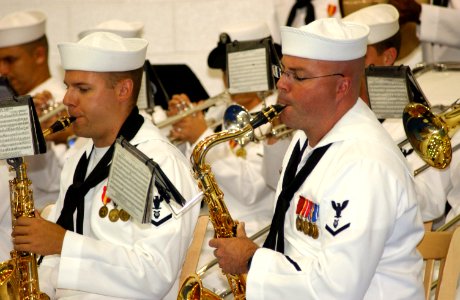 US Navy 060621-N-9458H-007 The Navy Band plays during the change of command ceremony on board Naval Air Station Joint Reserve Base, New Orleans photo