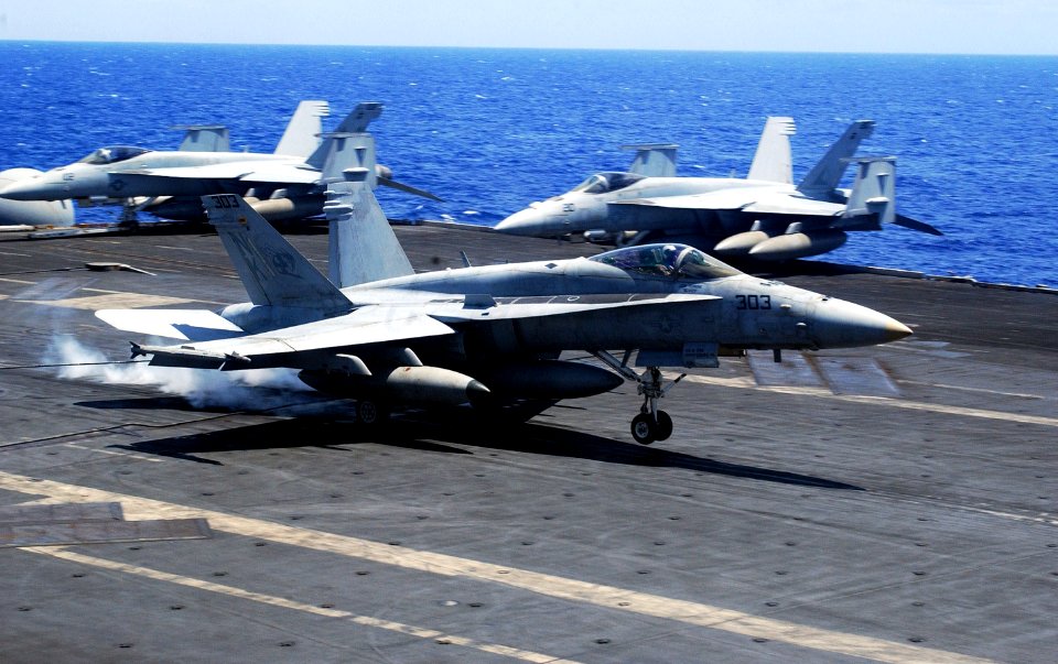 US Navy 060622-N-7730P-053 An F-A-18C assigned to the Stingers of Strike Fighter Squadron One One Three (VFA-113) makes an arrested landing on the flight deck aboard the Nimitz-class aircraft carrier