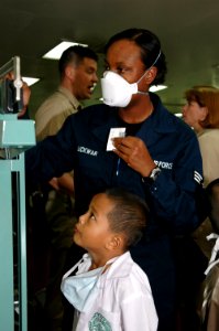 US Navy 060608-N-3714J-039 Air Force Senior Airman Cydionne Jaquay Lickwar, of Waxahachie, Texas, weighs a child during a Medical and Dental Civil Action Project aboard the U.S. Military Sealift Command (MSC) Hospital ship USNS