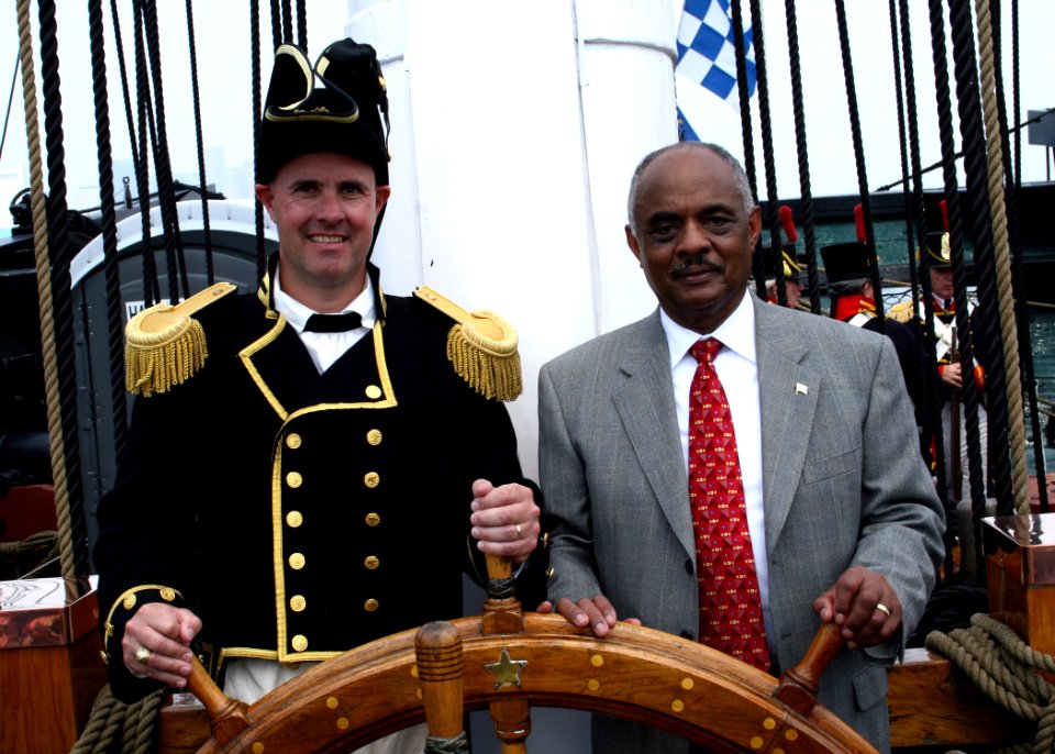US Navy 060623-N-5367L-002 Commanding Officer, Cmdr. Thomas C. Graves, and Assistant Secretary of the Navy for Installations and Environment, the Honorable B.J. Penn, man the helm aboard USS Constitution