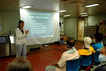 US Navy 060607-N-2832L-083 Penny Ching, occupational therapist with the Aloha Medical Mission, a nongovernmental organization aboard the U.S. Military Sealift Command (MSC) Hospital ship USNS Mercy (T-AH 19), teaches classes t