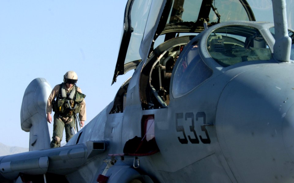 US Navy 060615-F-2185F-022 U.S. Air Force Capt. Matthew Polus conducts preflight checks on a U.S. Navy EA-6B Prowler aircraft before taking off from Bagram Airfield