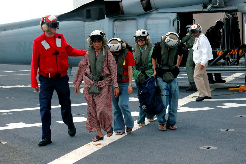 US Navy 060603-N-2832L-124 Patients to receive health care arrive by helicopter to the U.S. Military Sealift Command (MSC) Hospital ship USNS Mercy (T-AH 19)