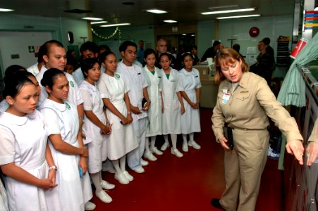 US Navy 060608-N-3714J-070 Navy Cmdr. Jeannie Comlish, of Washington, D.C., conducts a tour to nursing students from the Jolo Norte Dame Nursing School aboard the U.S. Military Sealift Command (MSC) Hospital ship USNS Mercy (T