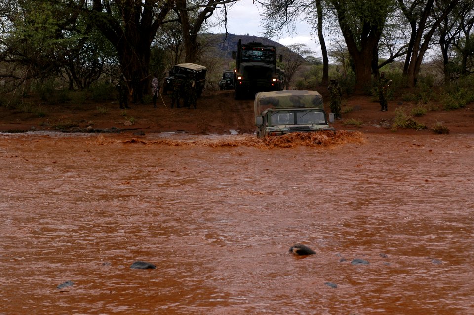 US Navy 060805-N-0411D-045 U.S. Marine Humvees and 7-Ton amphibious trucks powered through the strong current of the Nginyang River while many other vehicles were stuck on both sides