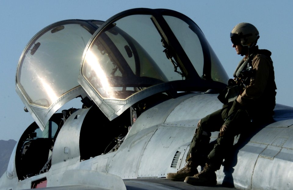 US Navy 060615-F-2185F-037 U.S. Air Force Capt. Matthew Polus conducts preflight checks on a U.S. Navy EA-6B Prowler aircraft before taking off from Bagram Airfield