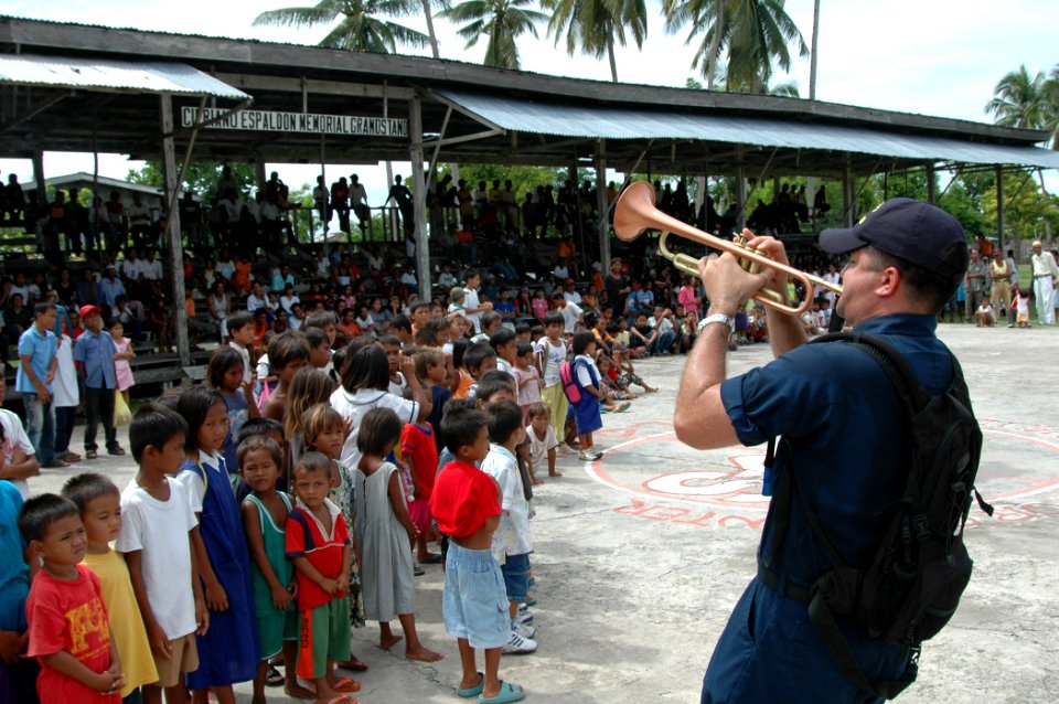 US Navy 060616-N-3532C-233 Musician 2nd Class Brandon Barbee and the U.S. Navy Show Band entertain local residents at a Medical and Dental Civil Action Project (MED-DENCAP)