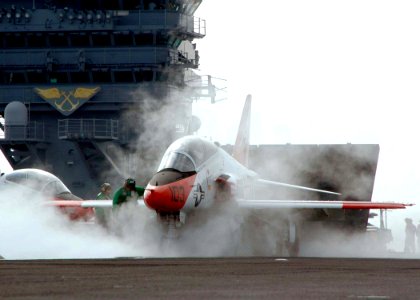 US Navy 060615-N-0490C-003 A Sailor aboard the Nimitz-class aircraft carrier USS Dwight D. Eisenhower (CVN 69) conducts safety checks on a T-45C Goshawk in preparation for launch