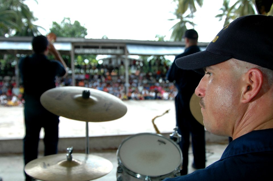 US Navy 060616-N-3532C-181 Musician 2nd Class Oscar Muñoznarves and the U.S. Navy Show Band entertain local residents at a Medical and Dental Civil Action Project (MED-DENCAP)
