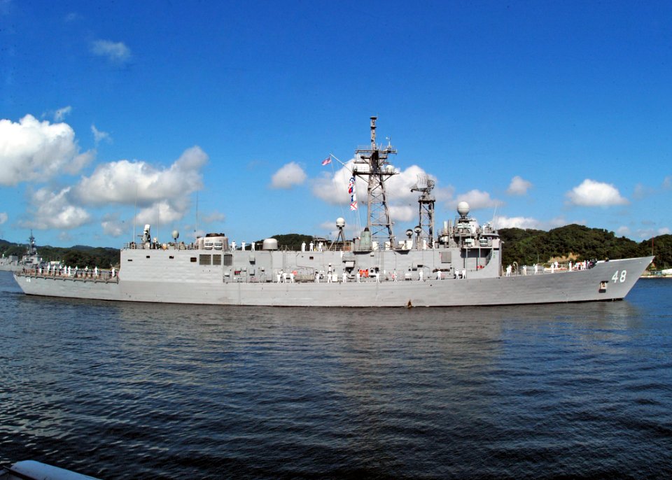 US Navy 060814-N-4649C-003 Sailors aboard the guided missile frigate USS Vandegrift (FFG 48) man the rails as the ship departs the pier for the last time as a homeported vessel of Commander, Fleet Activities Yokosuka, Japan