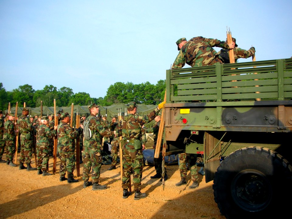 US Navy 060615-N-3241S-270 Navy Reservists from the Operational Health Support Unit, Great Lakes, (OHSU) assist in a working party to load supplies after tearing down camp