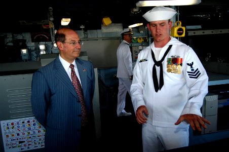 US Navy 060610-N-3642E-005 Quartermaster 1st Class Joshua Manuel gives Secretary of the Navy (SECNAV) the Honorable Dr. Donald C. Winter a tour of the bridge