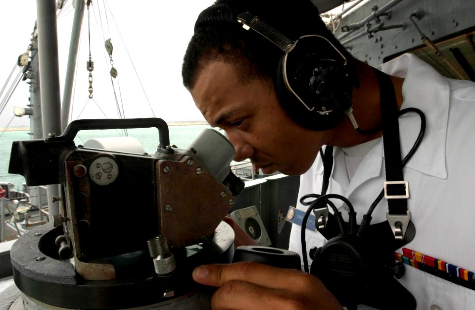 US Navy 060627-N-9851B-007 Quartermaster Seaman Henry Scipio reads the ship's bearings as the rescue and salvage ship USS Salvor (ARS 52) departs Thailand. Salvor is currently participating in the second phase of exercise Coope