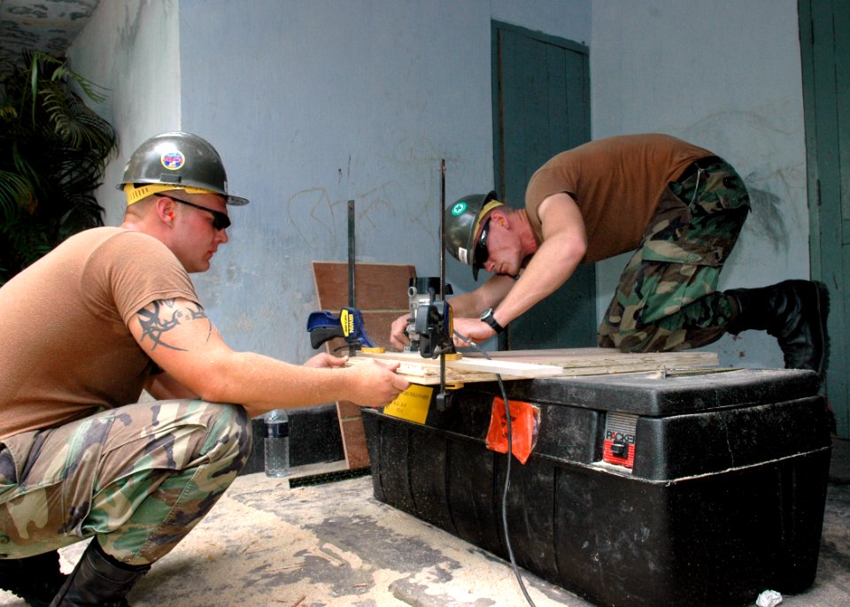 US Navy 060702-N-3714J-036 U.S. Navy Seabees assigned to Naval Mobile Construction Battalion Four Zero (NMCB-40), build cabinets for the Chittagong Medical and College Facility