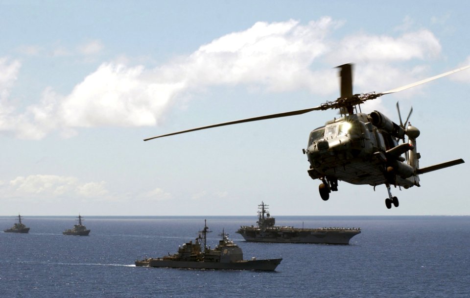 US Navy 060701-N-7130B-117 Prior to an air power demonstration by Carrier Air Wing Fourteen (CVW-14), the Ronald Reagan Carrier Strike group (CSG) moves into formation