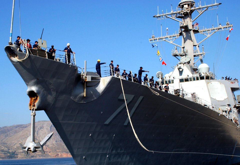 US Navy 060625-N-0780F-004 Crew members aboard the guided missile destroyer USS Ross (DDG 71) conduct mooring operations as they arrive for a brief port visit to Greece's largest island