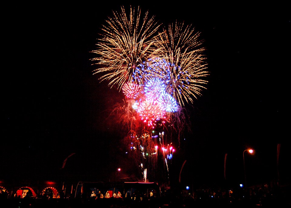 US Navy 060704-N-2716P-008 Sailors, family members and friends watch the fireworks display during the 4th of July celebration aboard Commander, U.S. Fleet Activities Yokosuka, Japan