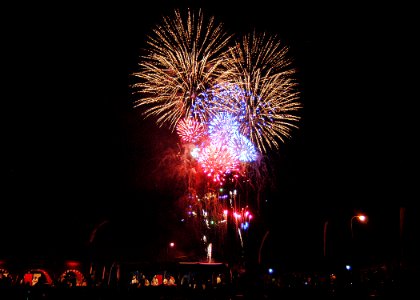 US Navy 060704-N-2716P-008 Sailors, family members and friends watch the fireworks display during the 4th of July celebration aboard Commander, U.S. Fleet Activities Yokosuka, Japan photo