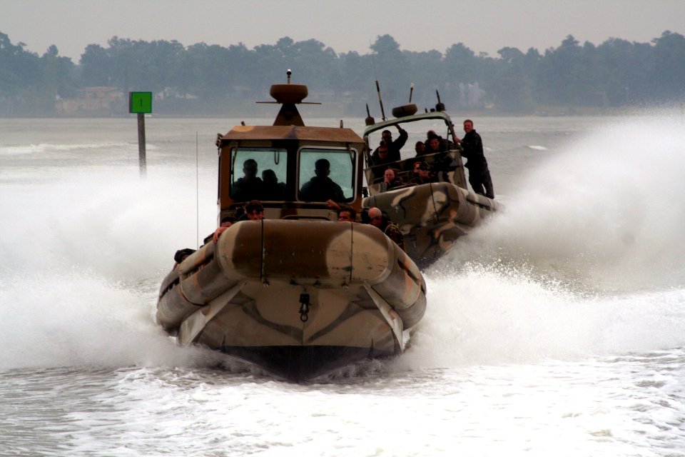 US Navy 060811-C-0000B-001 Riverine Squadron One members, based at Naval Amphibious Base Little Creek, train with Small Unit River Craft (SURC) Prototypes at the Special Missions Training Center