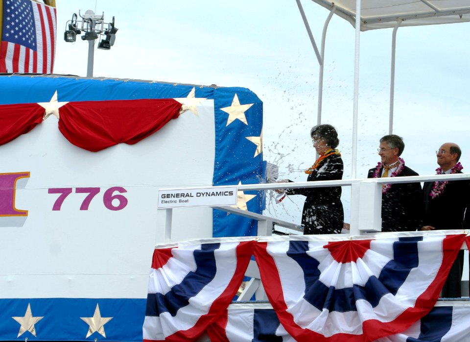 US Navy 060617-N-0653J-002 Hawaii Governor, the Honorable Linda Lingle smashes a bottle of champagne against the sail of the Virginia-class nuclear attack submarine Pre-Commissioning Unit (PCU) Hawaii (SSN 776) during the ship'