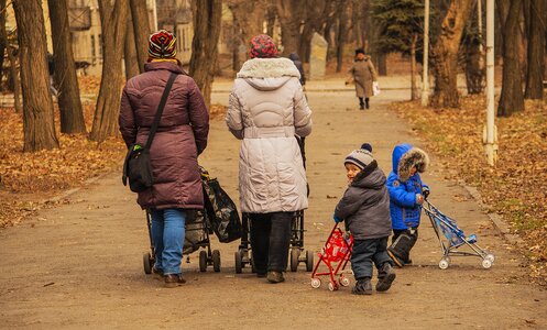 Strollers walk autumn