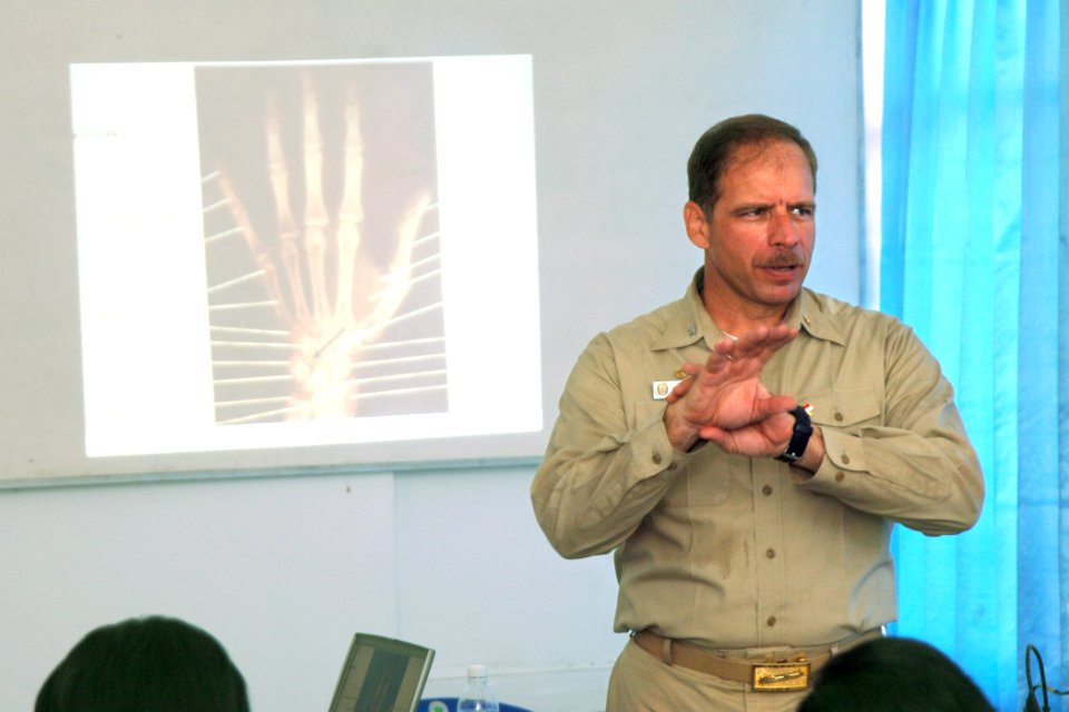 US Navy 060812-N-6501M-007 Capt. Joseph L. Moore, commanding officer, Medical Treatment Facility aboard the Military Sealift Command (MSC) hospital ship USNS Mercy (T-AH 19), gives a lecture on the diagnosis and treatment