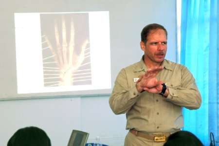 US Navy 060812-N-6501M-007 Capt. Joseph L. Moore, commanding officer, Medical Treatment Facility aboard the Military Sealift Command (MSC) hospital ship USNS Mercy (T-AH 19), gives a lecture on the diagnosis and treatment