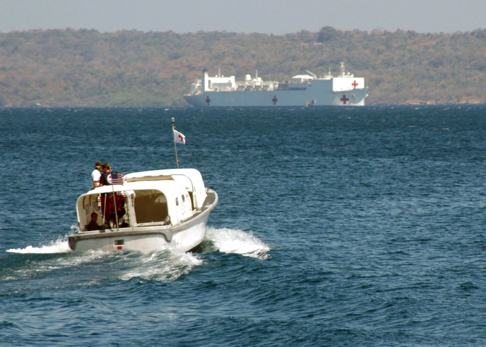 US Navy 060820-N-9076B-019 One of the Band Aid boats heads out to the Military Sealift Command (MSC) hospital ship USNS Mercy (T-AH 19), while it is anchored off the coast of West Timor