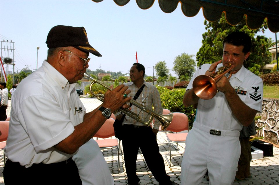 US Navy 060815-N-3714J-154 A local resident plays alongside Navy Musician 2nd Class Brandon Barbee