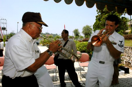 US Navy 060815-N-3714J-154 A local resident plays alongside Navy Musician 2nd Class Brandon Barbee