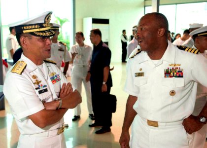 US Navy 060815-N-9851B-001 Commander, Destroyer Squadron One and the five-ship exercise Cooperation Afloat Readiness and Training (CARAT) Task Group, Capt. Al Collins talks with Commander Philippine Fleet, Rear Adm. George T Uy