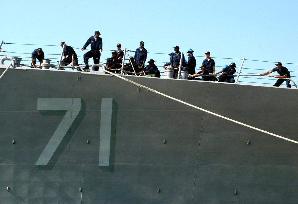 US Navy 060625-N-0780F-006 Crew members aboard the guided missile destroyer USS Ross (DDG 71) conduct mooring operations as they arrive for a brief port visit to Greece's largest island