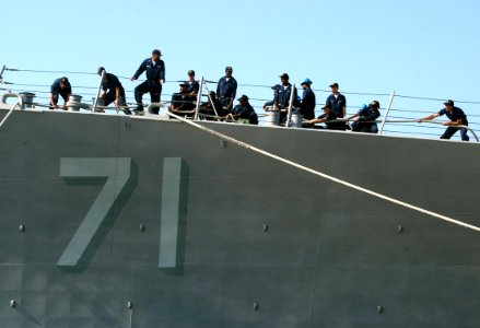 US Navy 060625-N-0780F-006 Crew members aboard the guided missile destroyer USS Ross (DDG 71) conduct mooring operations as they arrive for a brief port visit to Greece's largest island
