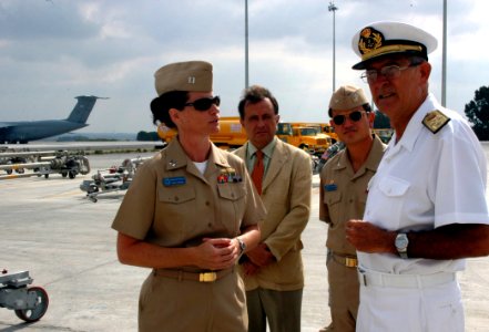 US Navy 060814-N-8539M-002 Naval Station Rota Fuels Officer, Lt. Christin Crowley, left, explains the capabilities of Rota's new fuel hydrant system