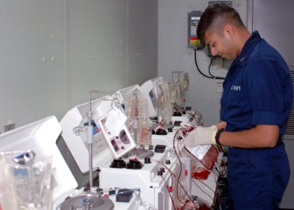 US Navy 060822-N-9076B-071 Navy Hospital Corpsman 3rd Class from the Medical Treatment Facility, works in the blood bank aboard the Military Sealift Command (MSC) hospital ship USNS Mercy (T-AH 19)
