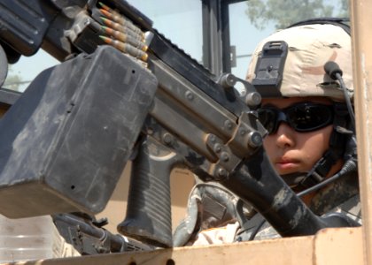US Navy 060817-N-8623S-005 Airman Stephanie Artea, a native of King City, Calif., mans the gun turret of a humvee while maintaining perimeter security in Al-Shuíllah, Iraq