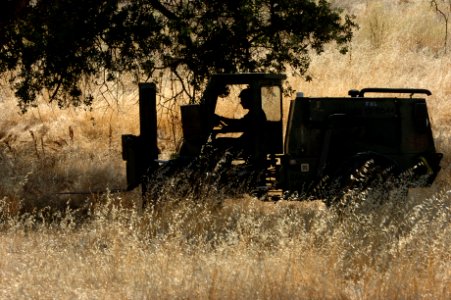 US Navy 060817-N-0775Y-011 A Navy Seabee from Naval Mobile Construction Battalion Three (NMCB-3) drives a 4K-forklift along the perimeter of the camps Logistics Support Area (LSA)