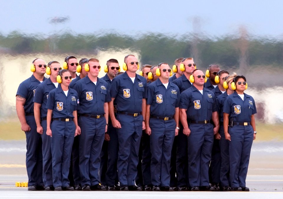 US Navy 060813-F-7049H-045 Crew chiefs with the United States Naval Flight Demonstration Squadron stand at attention as the Blue Angels prepare to disembark on their aerial performance