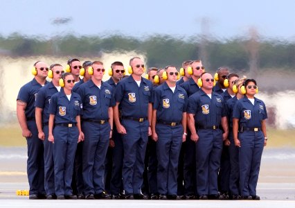 US Navy 060813-F-7049H-045 Crew chiefs with the United States Naval Flight Demonstration Squadron stand at attention as the Blue Angels prepare to disembark on their aerial performance