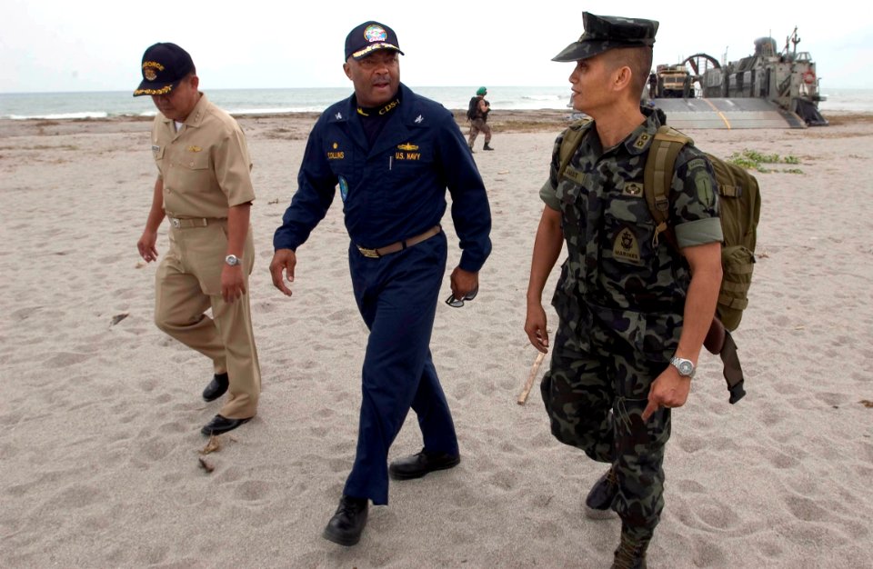 US Navy 060818-N-9851B-003 - Philippine Navy Capt. Orwen Cortez, Capt. Al Collins and Philippine Marine Lt. Col. Emmanuel Salamat talk after debarking landing craft air cushion Seven Three (LCAC 73)