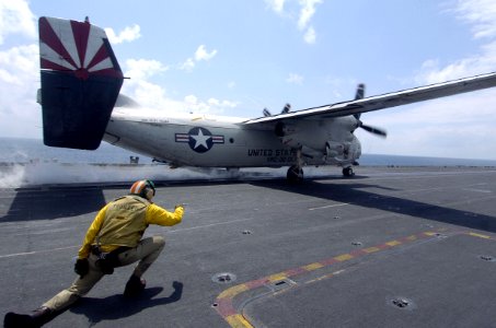 US Navy 060824-N-8604L-256 Lt. Cmdr. Keith Demetriades launches a C-2A Greyhound assigned to Fleet Logistics Support Squadron three Zero (VRC-30) off the flight deck of the conventional powered aircraft carrier USS Kitty Hawk (