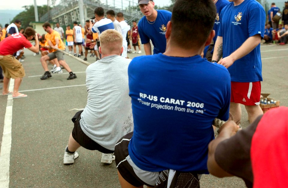US Navy 060817-N-9851B-008 U.S. and Philippine Navy Sailors compete in tug-of-war as integrated teams during Sports Day as part of the Philippines phase of exercise Cooperation Afloat Readiness and Training (CARAT)