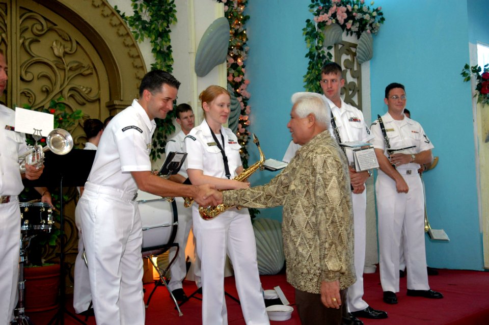 US Navy 060820-N-3714J-037 Governor of Kupang, Piet Tallo greets members of the U.S. Navy Showband, embarked aboard the Medical Treatment Facility aboard the Military Sealift Command (MSC) hospital ship USNS Mercy (T-AH 19), du
